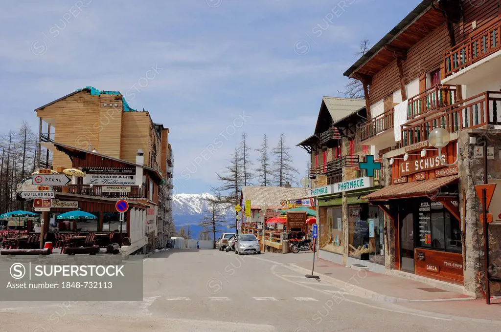 Road with a restaurant, shops and a pharmacy in Valberg, Alpes-Maritimes department, Provence-Alpes-Cote d'Azur, Southern France, France, Europe, Publ...