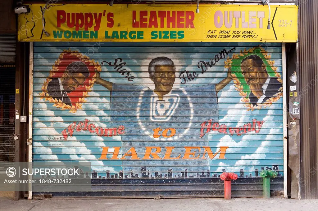Painted shutters of a clothing store in Harlem, West 125th Street, Nelson Mandela holding up the portraits of Malcolm X and Martin Luther King, with w...