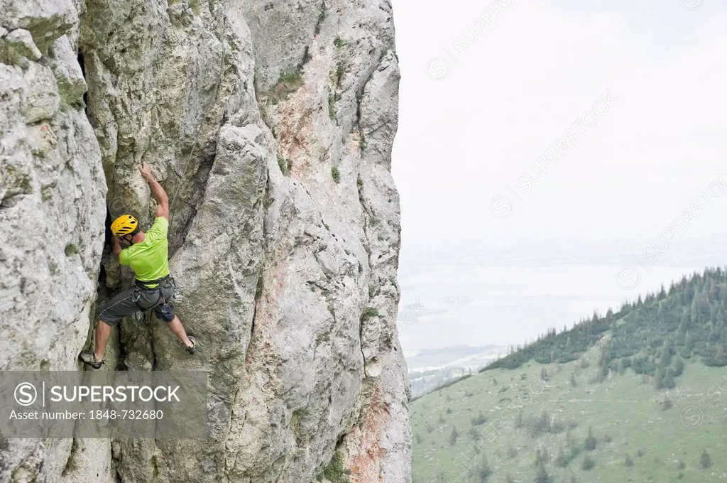 Climber in Mt Kampenwand, Chiemgau region, Bavaria, Germany, Europe