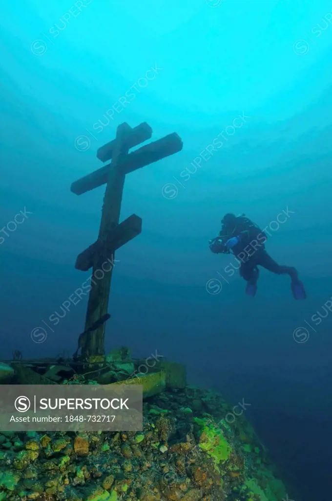 Diver looking at a cross, consecrated and established on Feast of the Ascension 09.06.2005, Lake Baikal, Siberia, Russian Federation, Eurasia