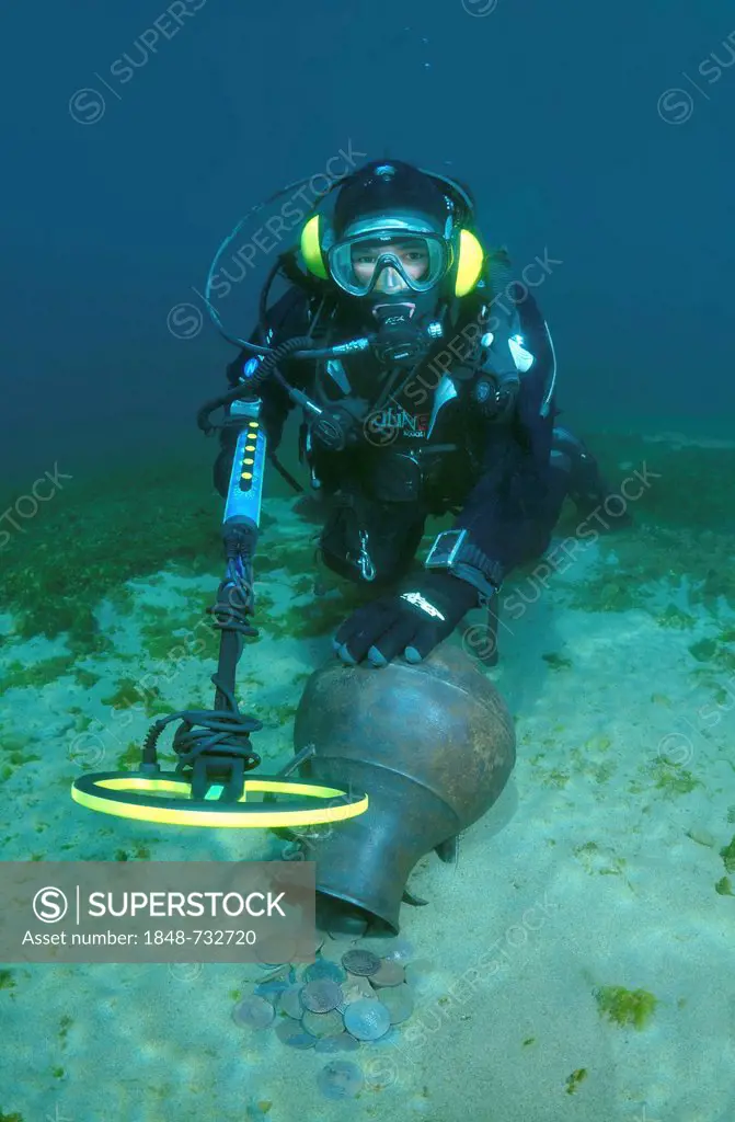 Diver with metal detector looking for a treasure under water, Lake Baikal, Siberia, Russia, Eurasia