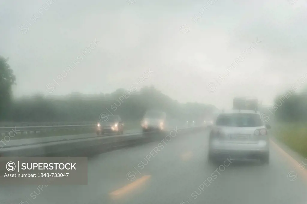 View through the windshield of a car driving on a highway in the rain, Lower Saxony, Germany, Europe