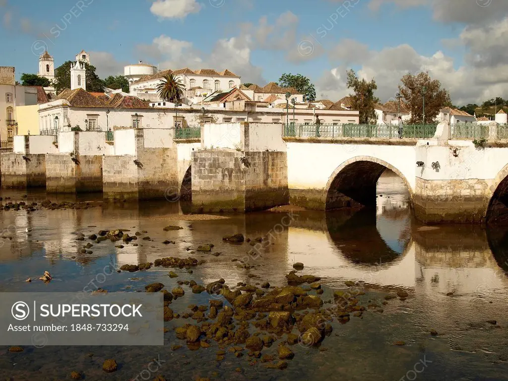 Old town and the Roman bridge reflected in the Gilao river, Tavira, Algarve, Portugal, Europe