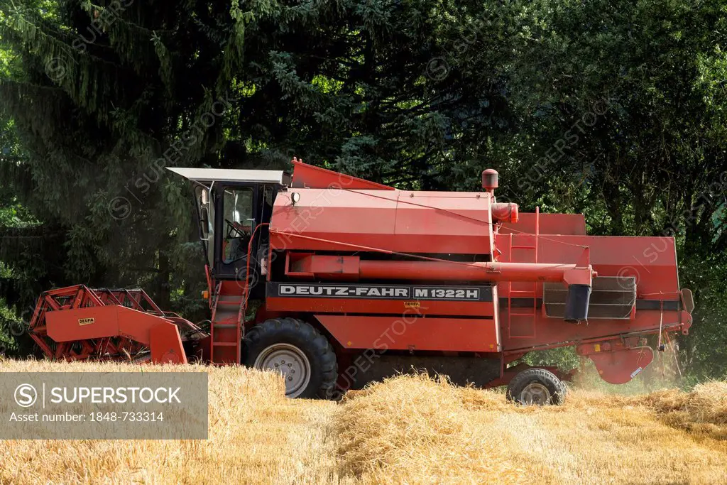 Deutz Fahr M1322H combine harvester in a wheat field, Baden-Wuerttemberg, Germany, Europe