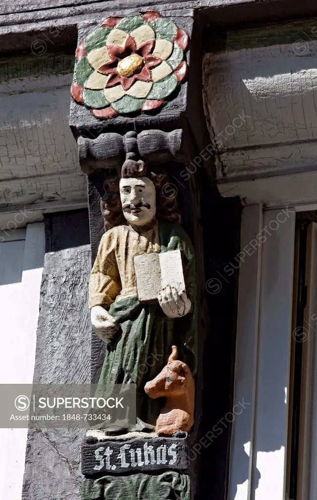 Evangelist Luke, carved figure on the Haus Walhalla building, historic half-timbered house, historic town centre, Osnabrueck, Lower Saxony, Germany, E...