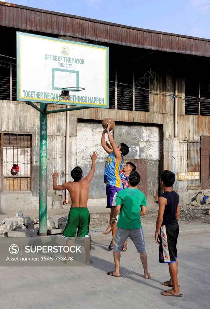 Boys playing basketball on a street in Cebu, Philippines, Southeast Asia, Asia