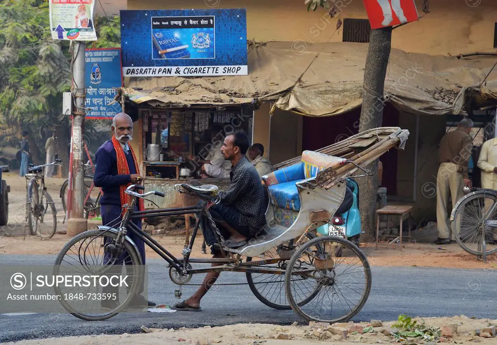 Street scene, two Indian men with bicycle rickshaws, Sarnath, Varanasi, Uttar Pradesh, India, Asia