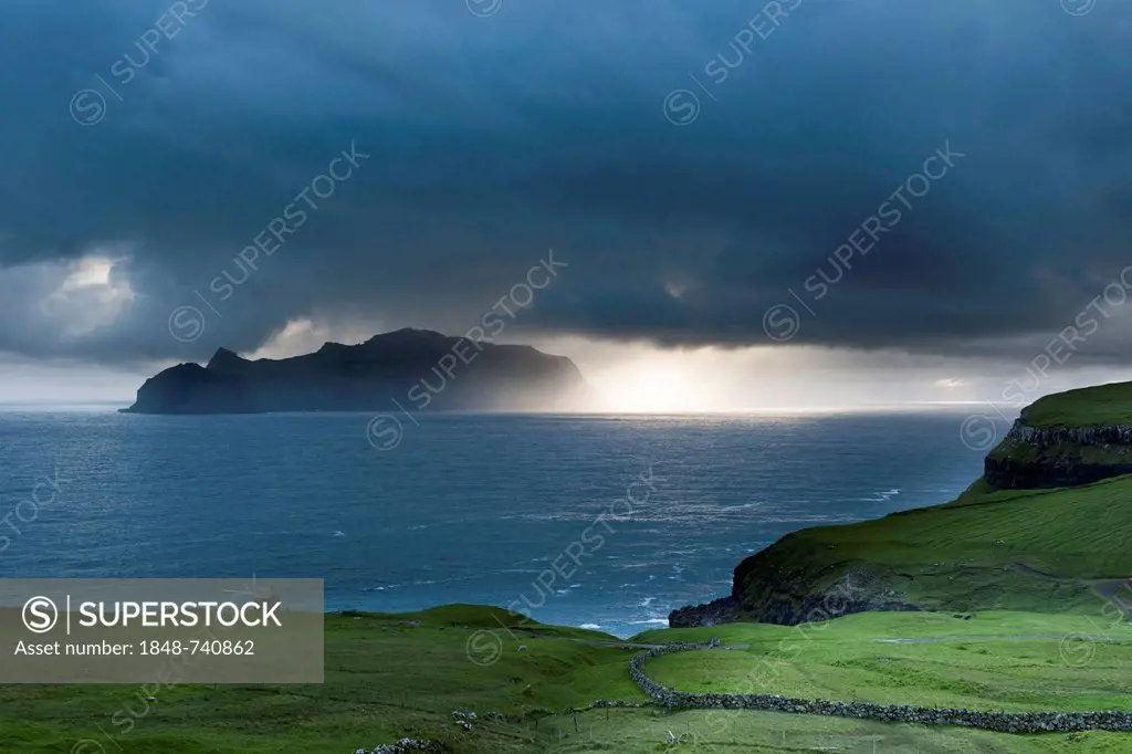 Last evening sun rays over the island of Mykines in the North Atlantic, Faroe Islands, North Sea, Northern Europe, Europe