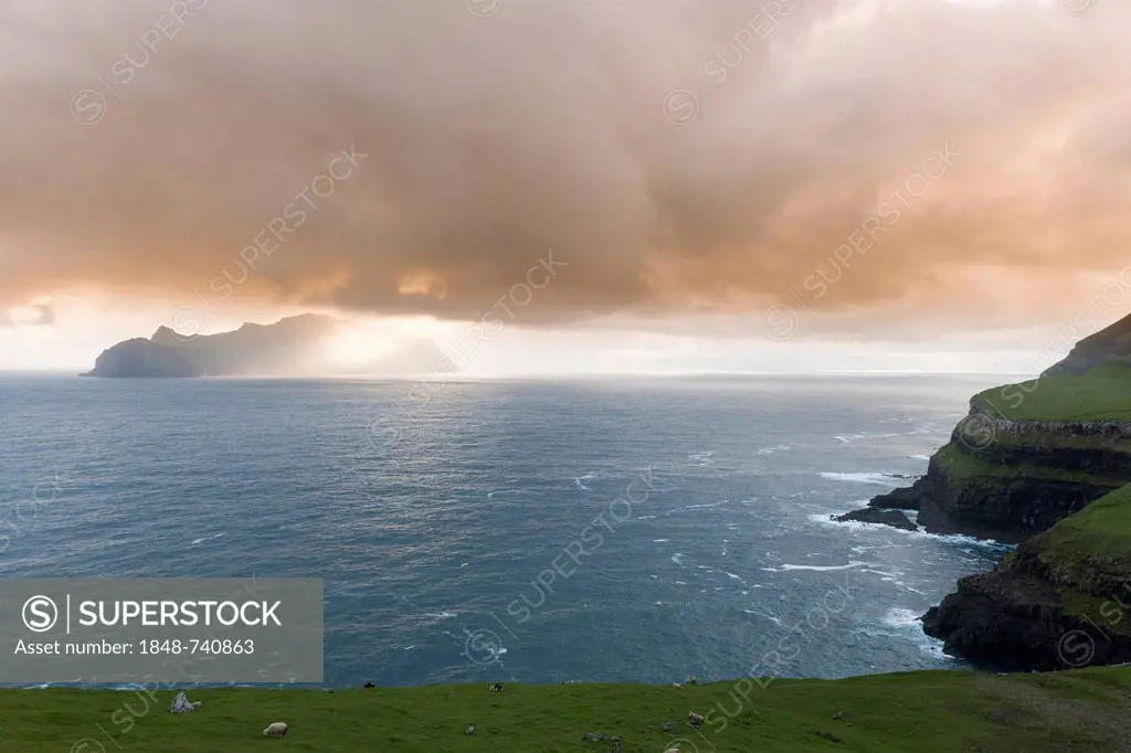 Last evening sun rays over the island of Mykines in the North Atlantic, Faroe Islands, North Sea, Northern Europe, Europe