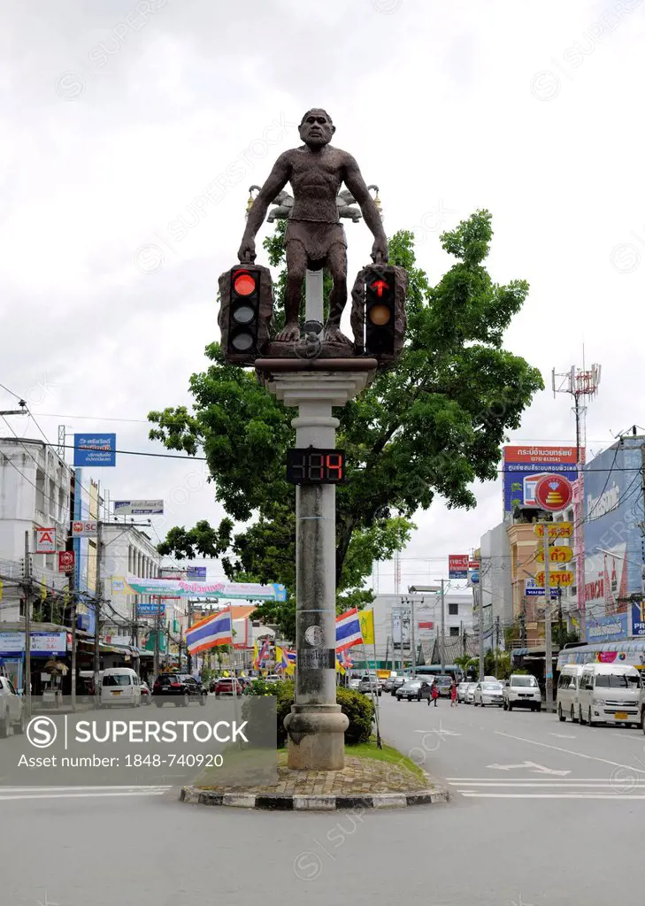Caveman sculpture holding traffic lights, Krabi Town, Krabi, Thailand, Asia