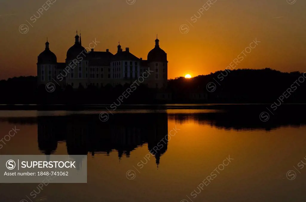 Schloss Moritzburg at sunset, a former castle to celebrate hunting, situated 10 km out of the City Dresden in the middle of beautiful forrests and lak...
