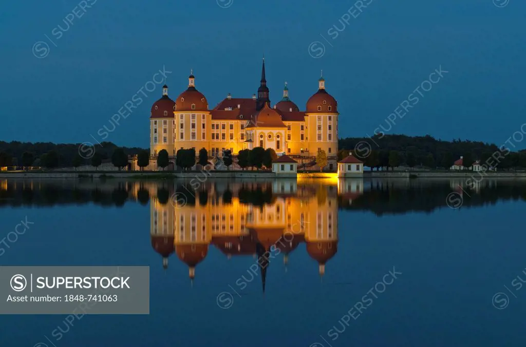 Schloss Moritzburg at night, a former castle to celebrate hunting, situated 10 km out of the City Dresden in the middle of beautiful forrests and lake...