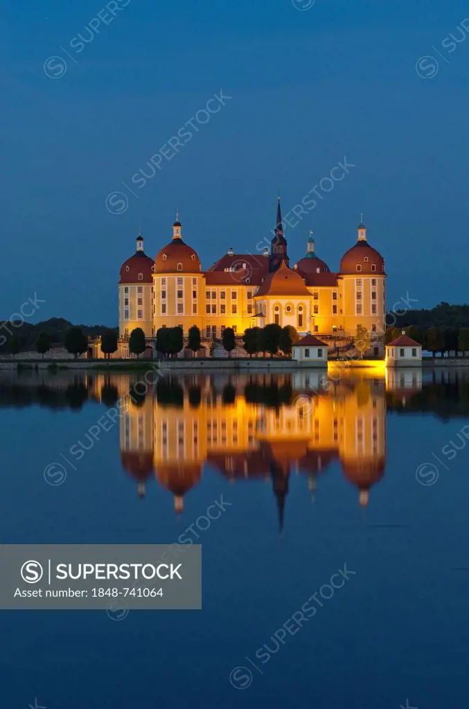 Schloss Moritzburg at night, a former castle to celebrate hunting, situated 10 km out of the City Dresden in the middle of beautiful forrests and lake...