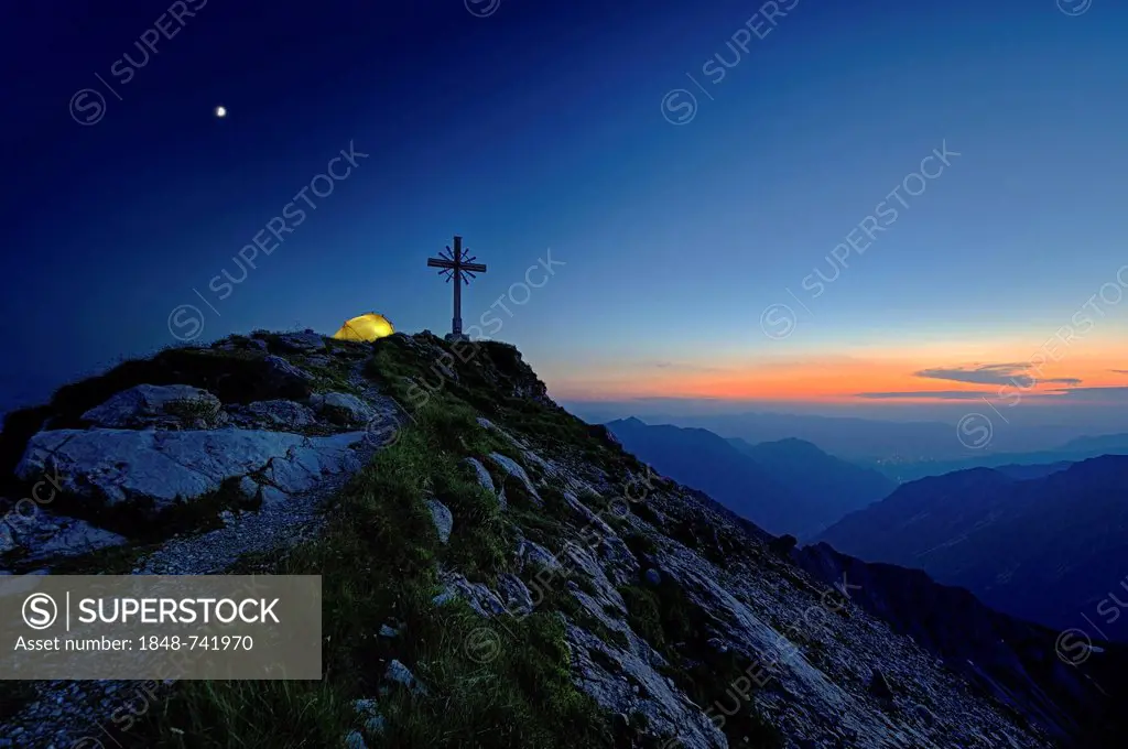 Blue hour with a mountain panorama and a tent at the summit cross, Geisshorn Mountain, Tannheim Valley, Tyrol, Austria, Europe
