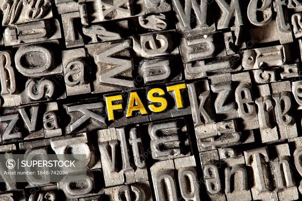 Old lead letters forming the word fast
