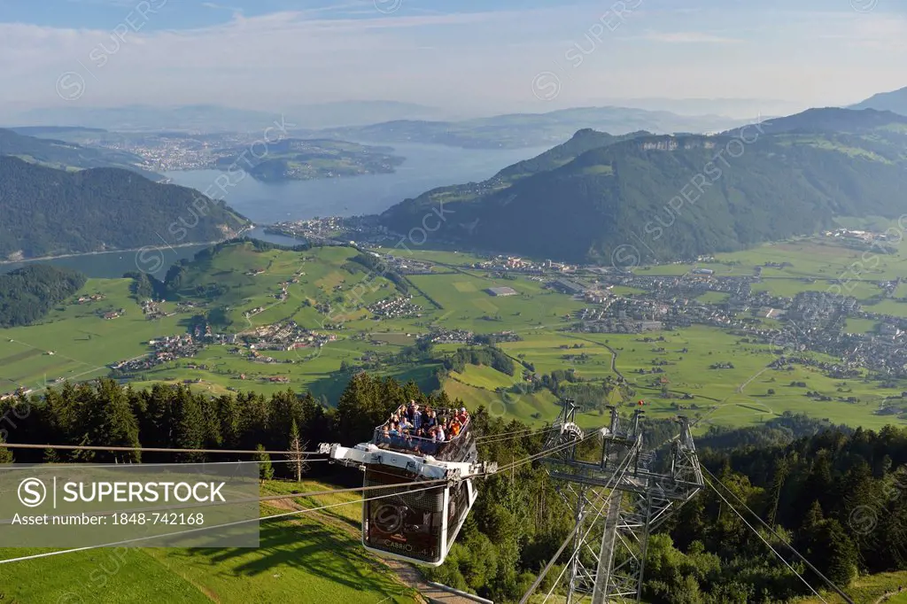 CabriO Bahn, the world's first cable car with an open top deck, going up Stanserhorn Mountain, Stans, Switzerland, Europe