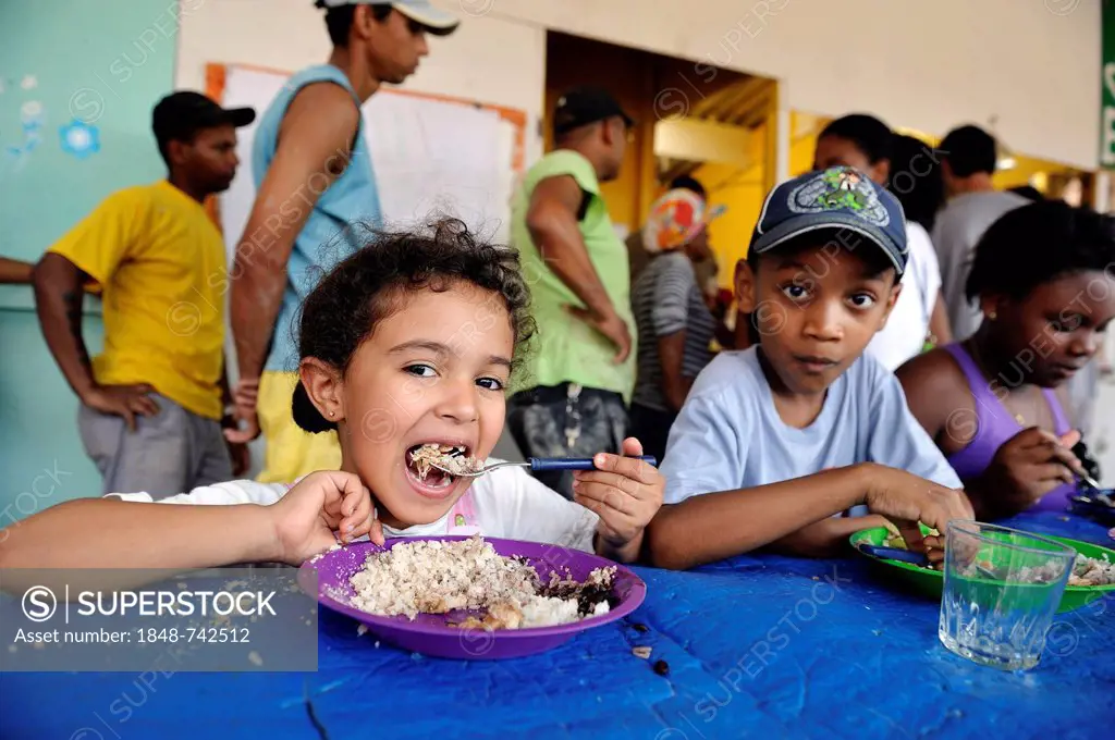 Children receiving food in the canteen, Jacerepagua neighbourhood, Rio de Janeiro, Brazil, South America