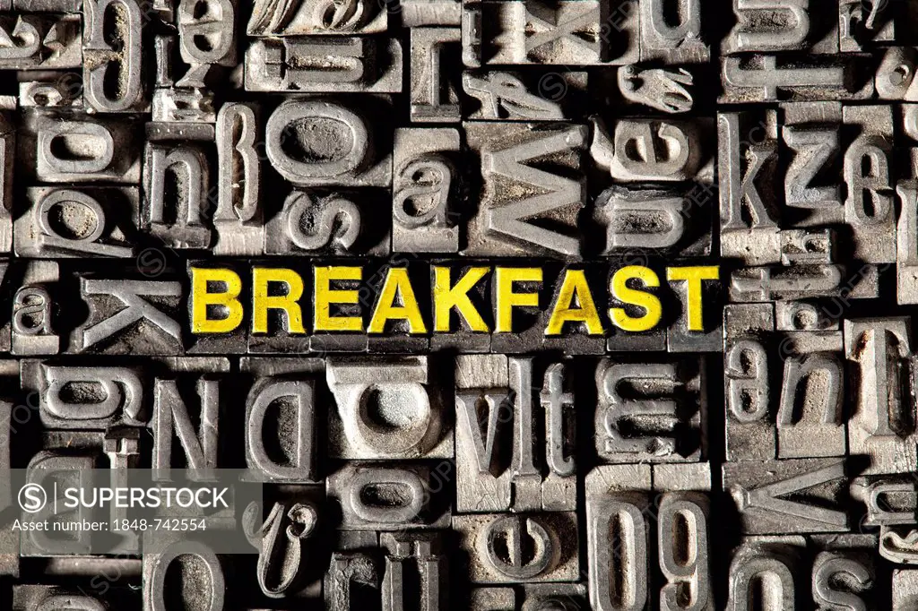 Old lead letters forming the word breakfast