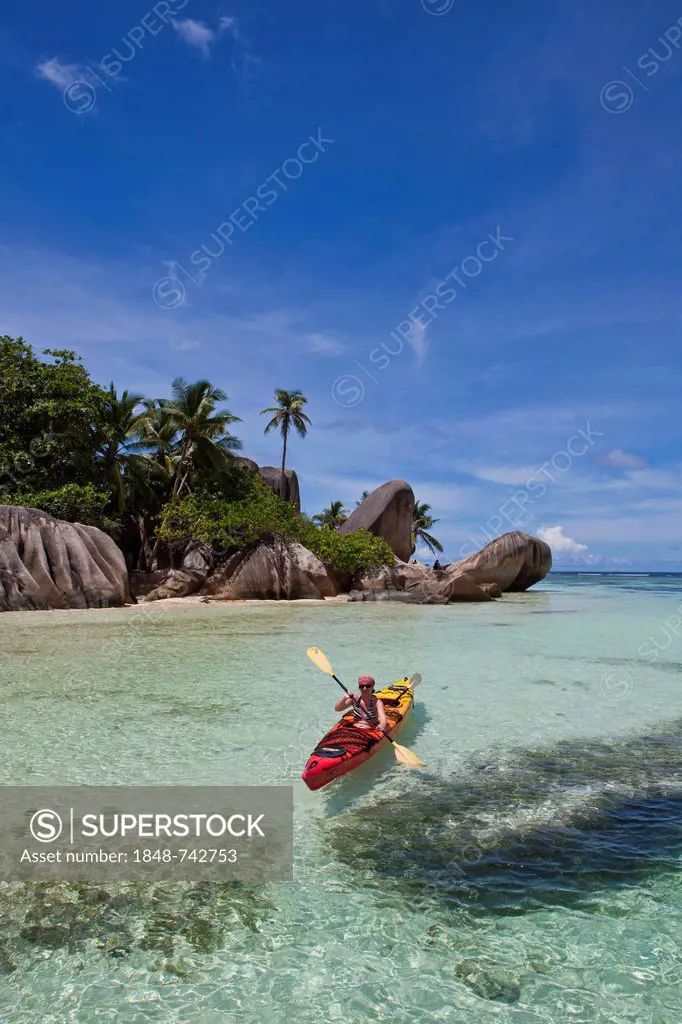 Woman, 40, kayaking, Point Source d'Argent, La Digue Island, Seychelles, Africa, Indian Ocean