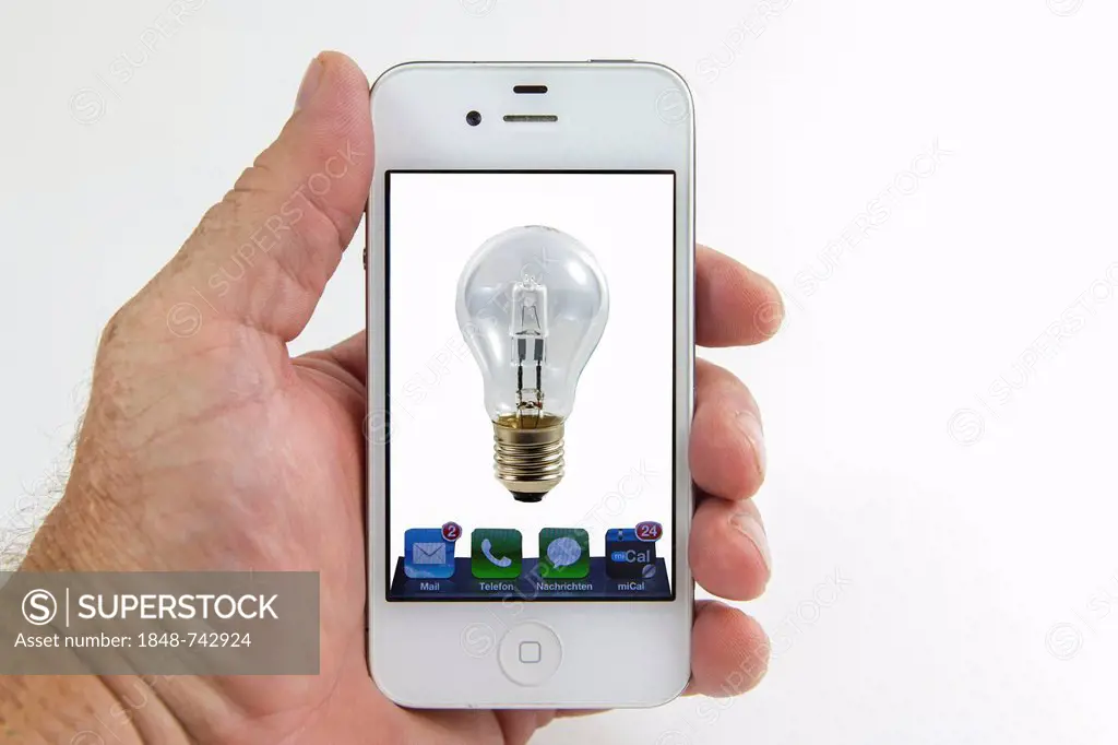 Light bulb on the screen of a smartphone, symbolic image for remote-controlled lights, mobile phone as a remote control