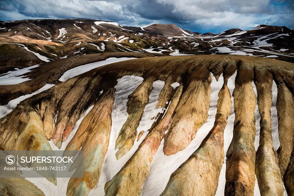 Aerial view, rhyolite mountains partially covered with snow, Landmannalaugar, Fjallabak conservation area, Icelandic Highlands, Iceland, Europe