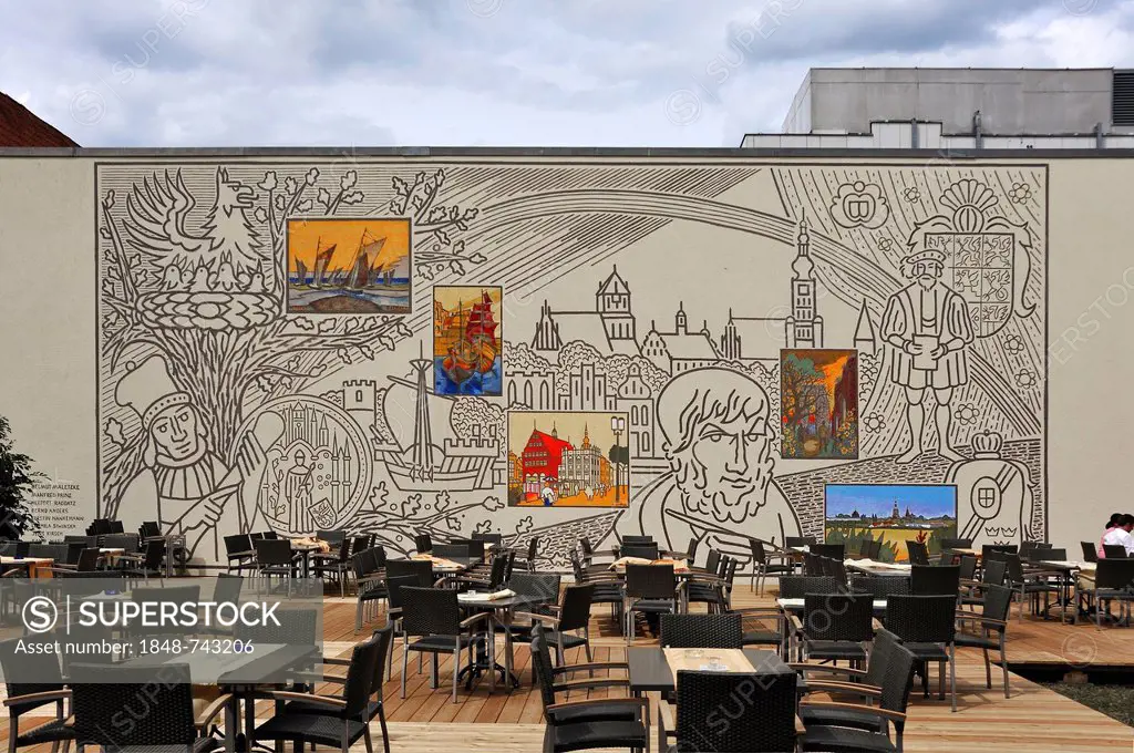 Mural paintings depicting Greifswald and a portrait by Caspar David Friedrich, chairs of a cafe in the foreground, Lappstrasse street, Greifswald, Mec...