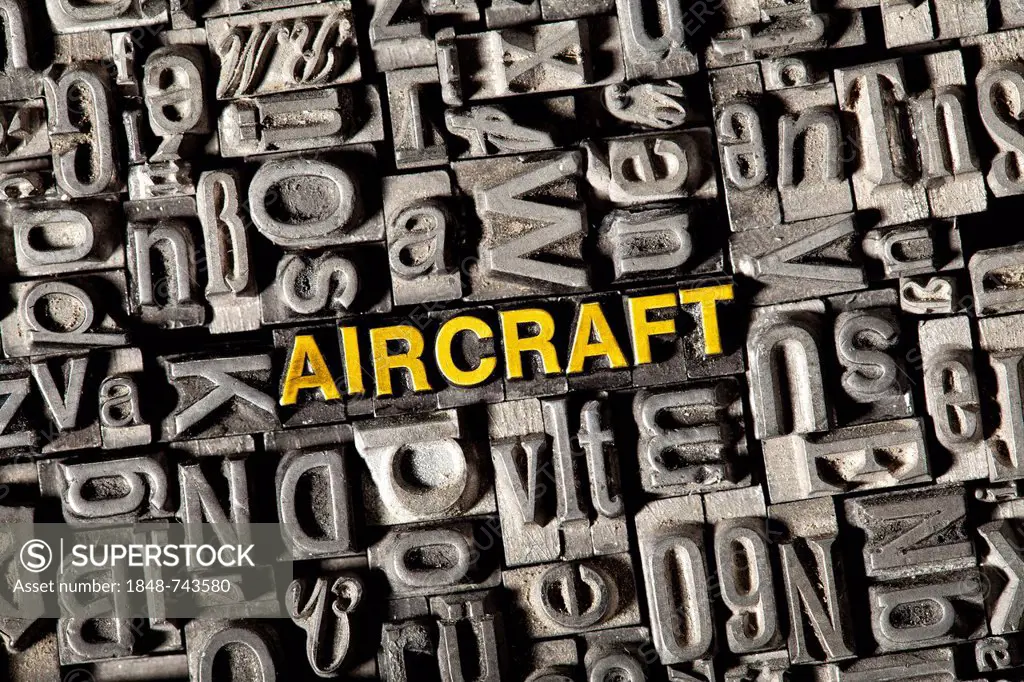 Old lead letters forming the word aircraft