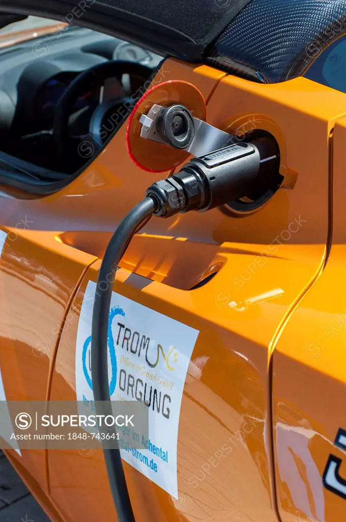 Tesla Roadster, an American electric sports car having its batteries charged before the prologue of the e-miglia 2012 from Munich to St. Moritz, Munic...
