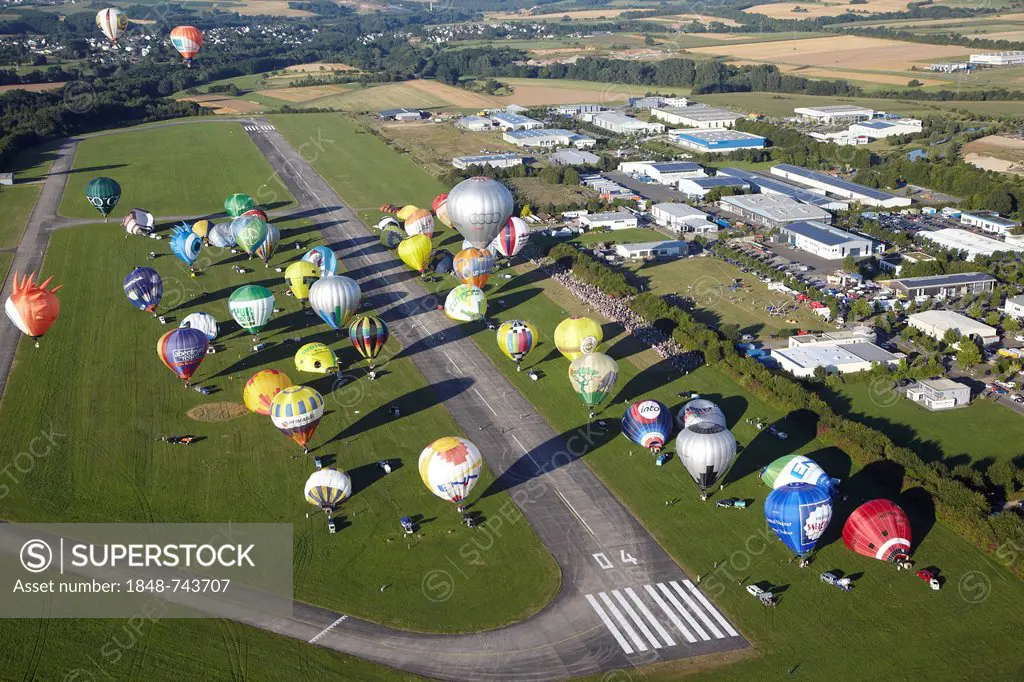 Aerial view, hot air balloon launch during the Mosel Ballon Fiesta, balloon festival, at Foehren airfield near Trier, Rhineland-Palatinate, Germany, E...