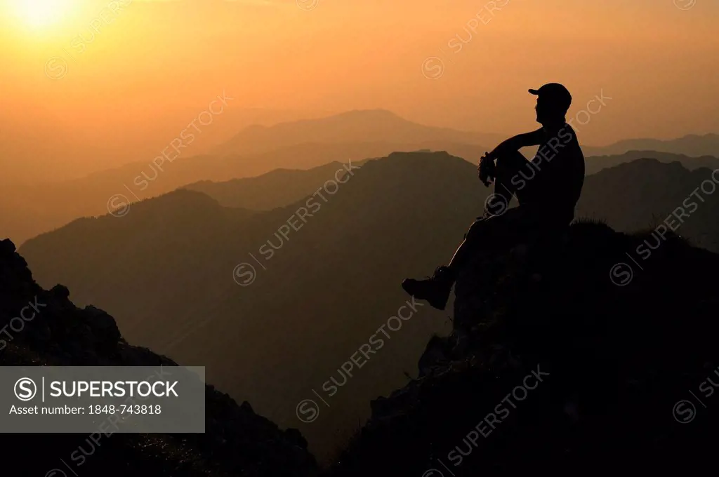 Sunset with a silhouette of a mountain climber, Geisshorn Mountain, Tannheim Valley, Tyrol, Austria, Europe
