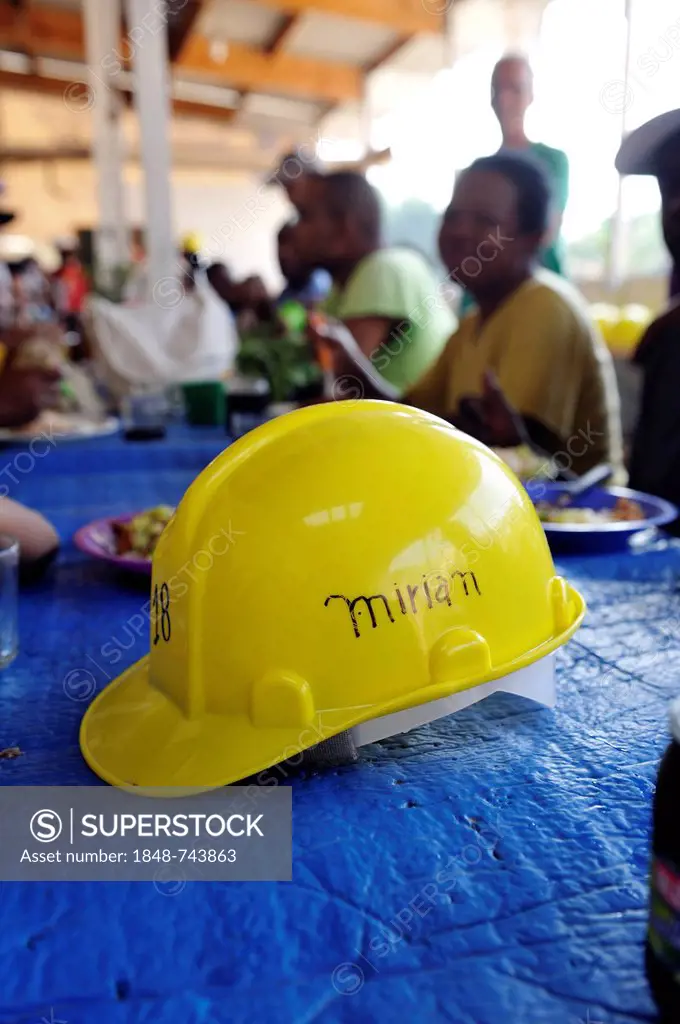 Hard hat with the inscription Miriam lying on the table of a canteen at a building site of the Esperanca housing co-operative, each family helping out...