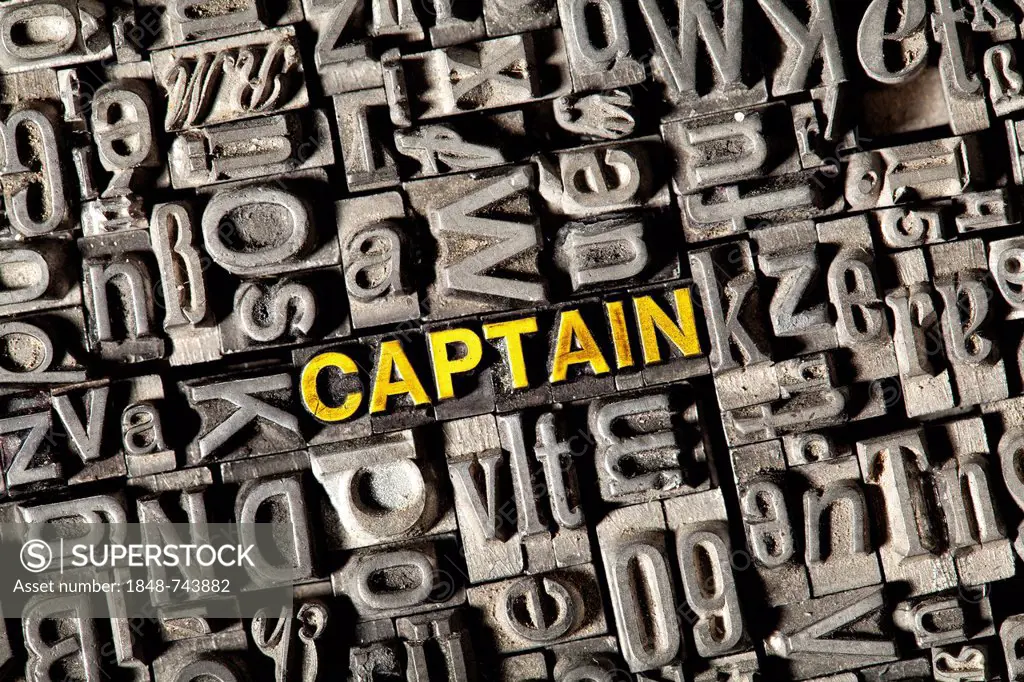 Old lead letters forming the word captain