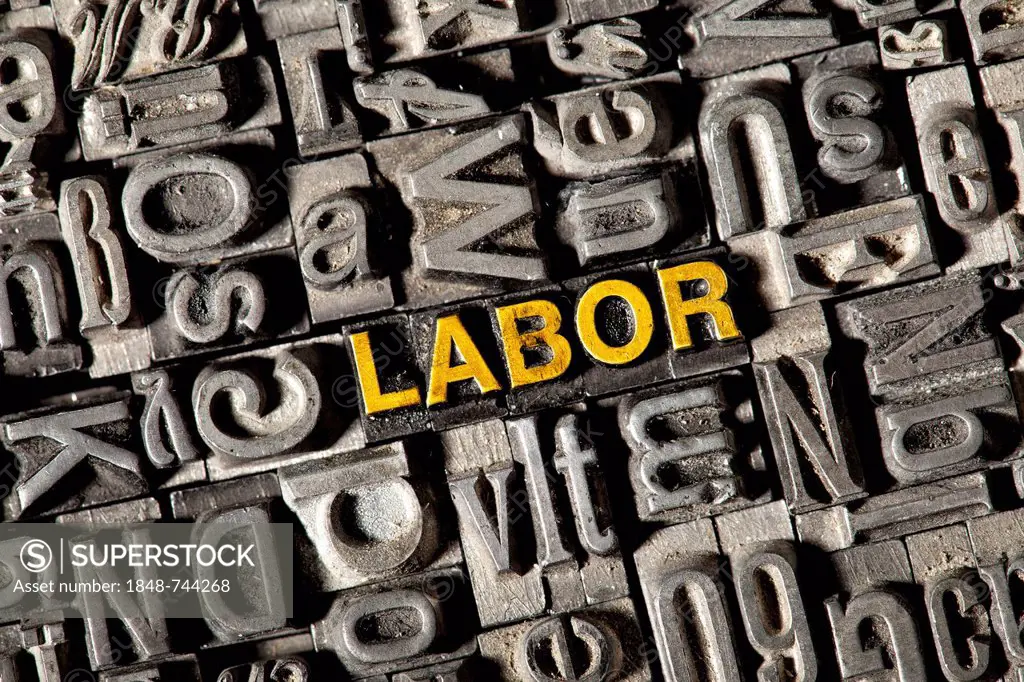 Old lead letters forming the word LABOR