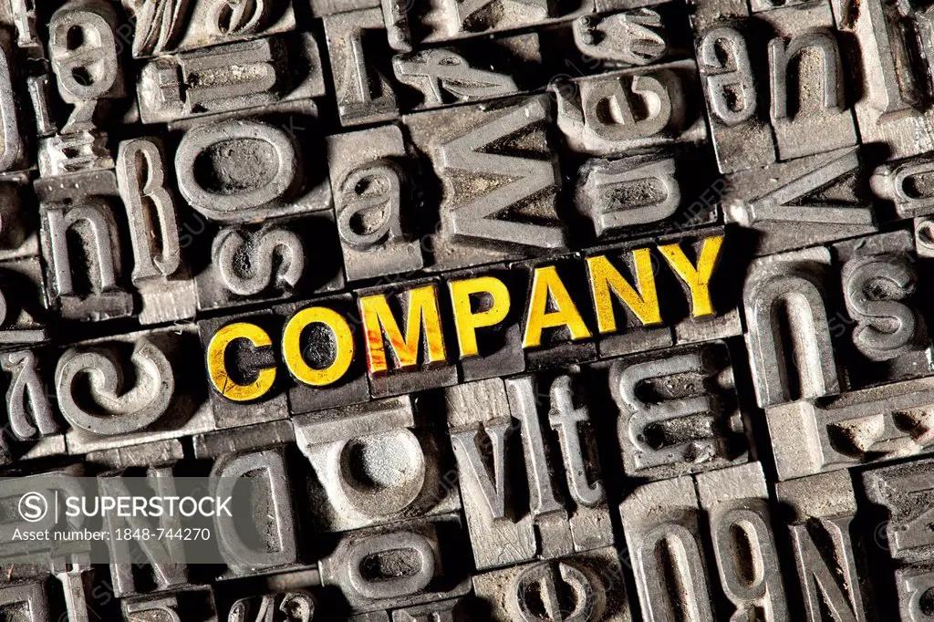 Old lead letters forming the word COMPANY