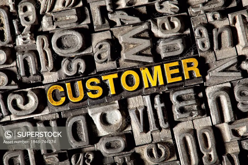 Old lead letters forming the word CUSTOMER