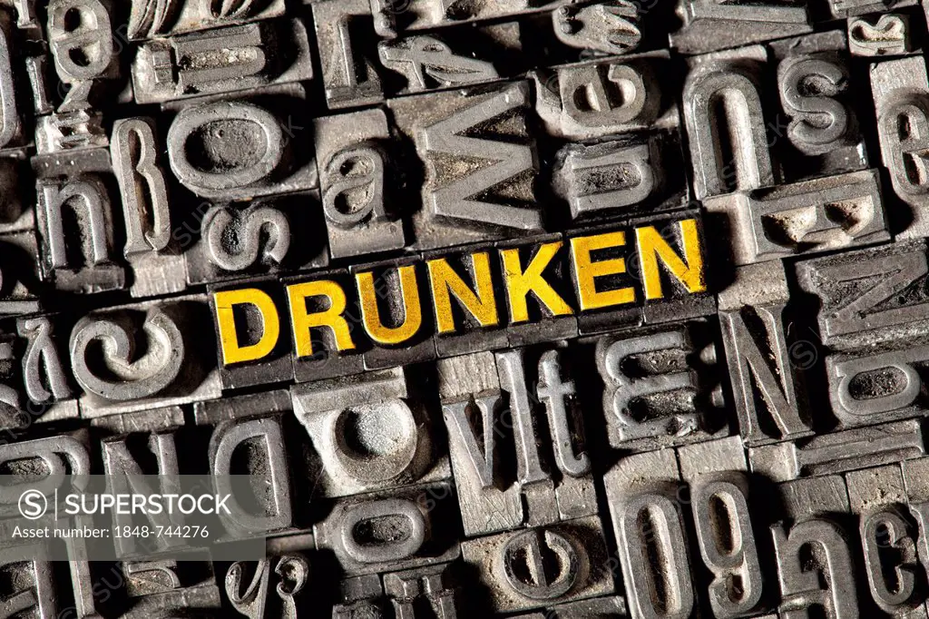 Old lead letters forming the word DRUNKEN