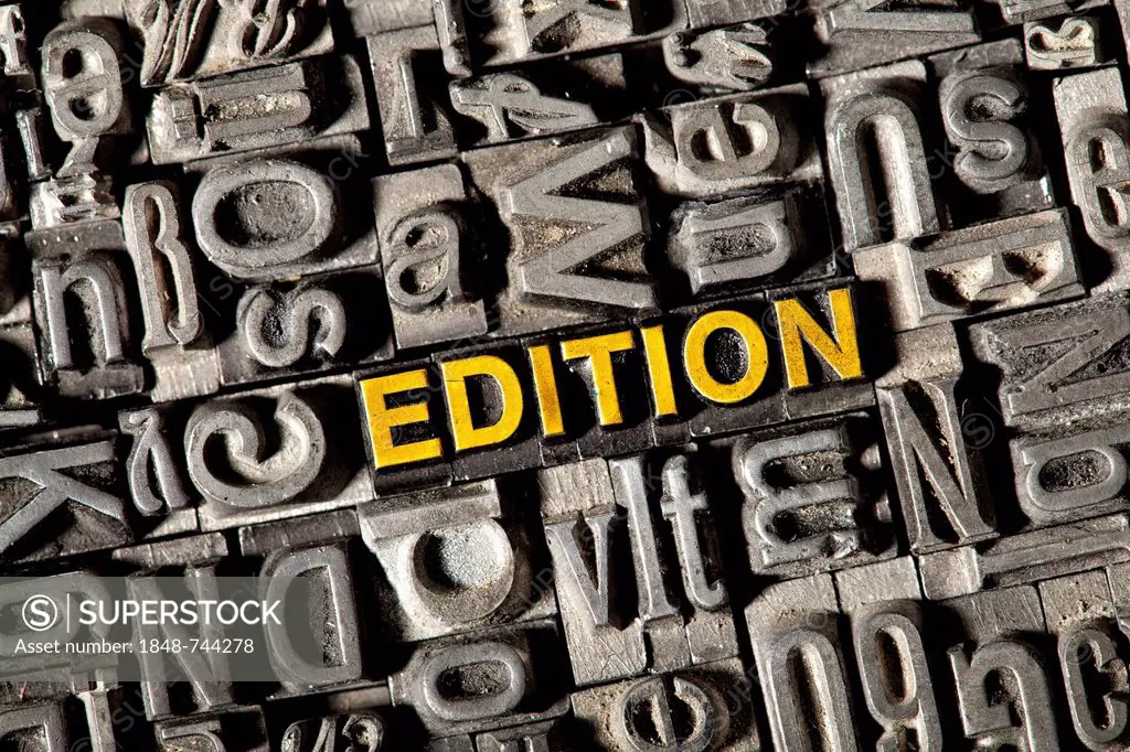 Old lead letters forming the word EDITION
