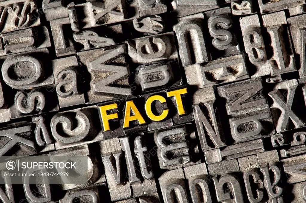 Old lead letters forming the word FACT
