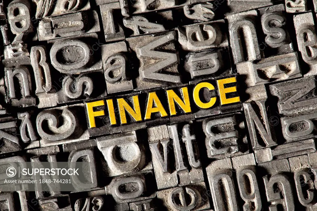 Old lead letters forming the word FINANCE