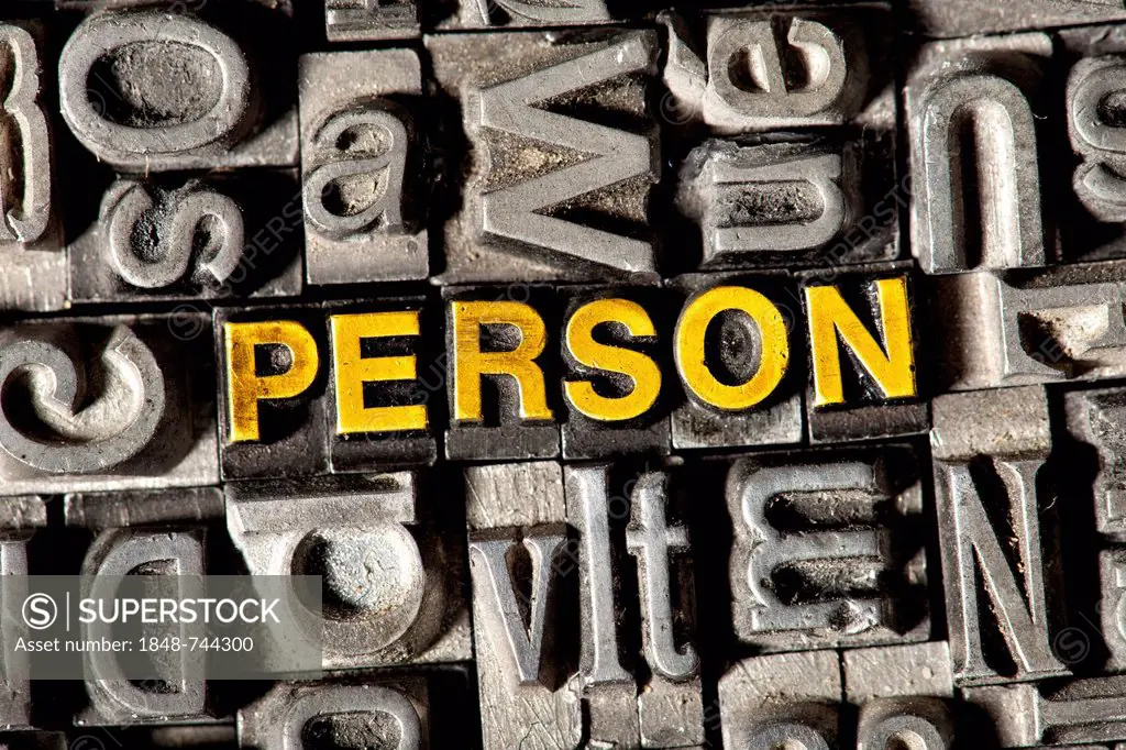 Old lead letters forming the word PERSON