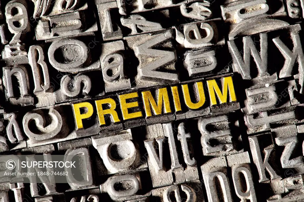 Old lead letters forming the word PREMIUM