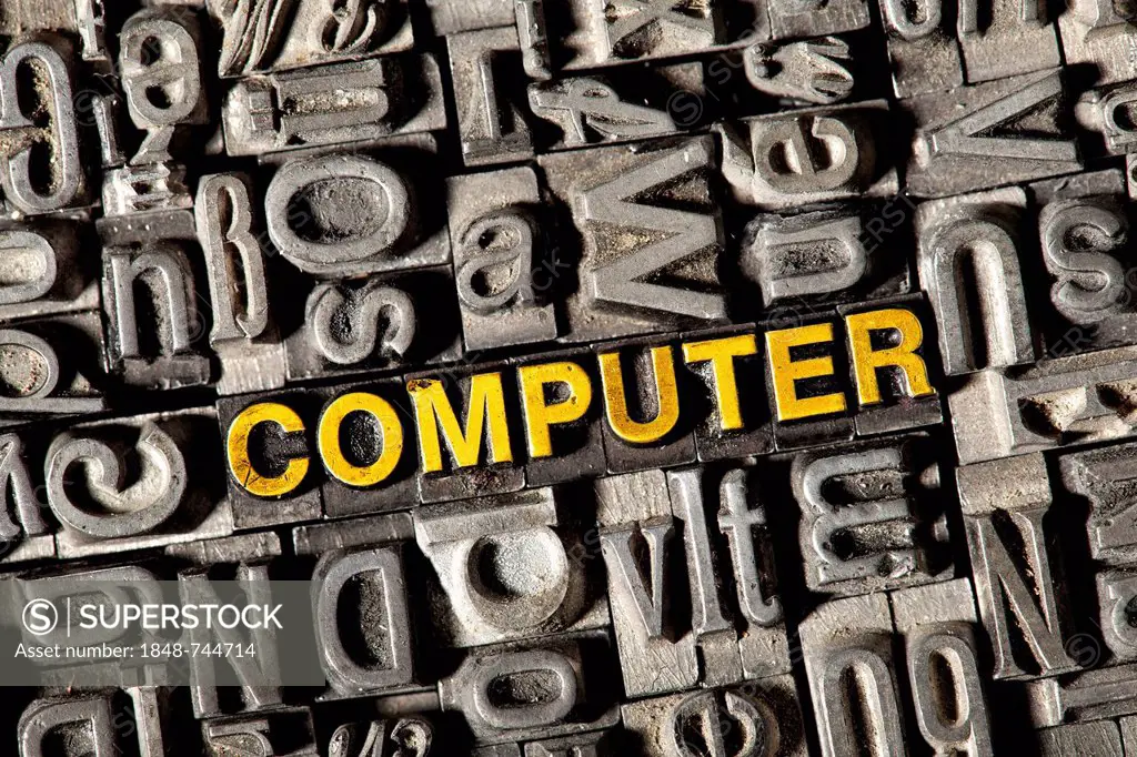 Old lead letters forming the word COMPUTER