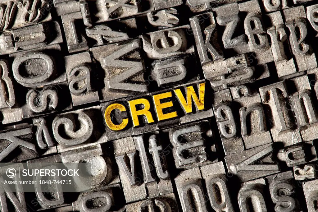 Old lead letters forming the word CREW