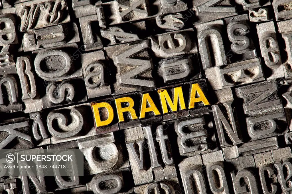 Old lead letters forming the word DRAMA