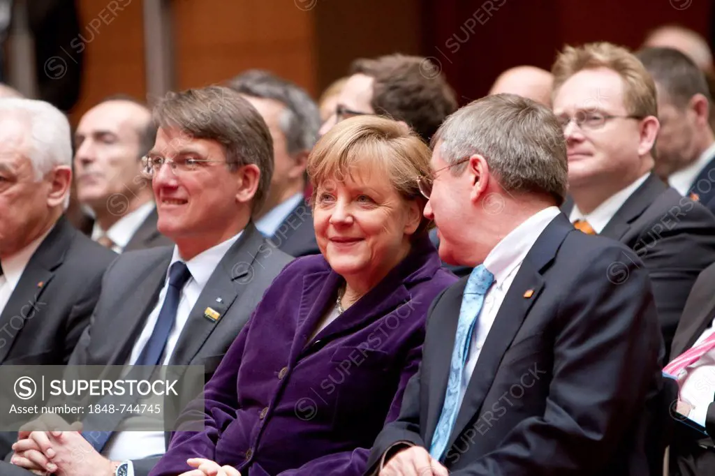 From left to right: Uwe Froehlich, President of the Federal Association of German Cooperative Banks, BVR, Angela Merkel, German Federal Chancellor, Dr...