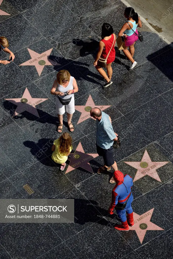 Tourists taking photographs in front of terrazzo star for Britney Spears, Walk of Fame, Hollywood Boulevard, Hollywood, Los Angeles, California, Unite...