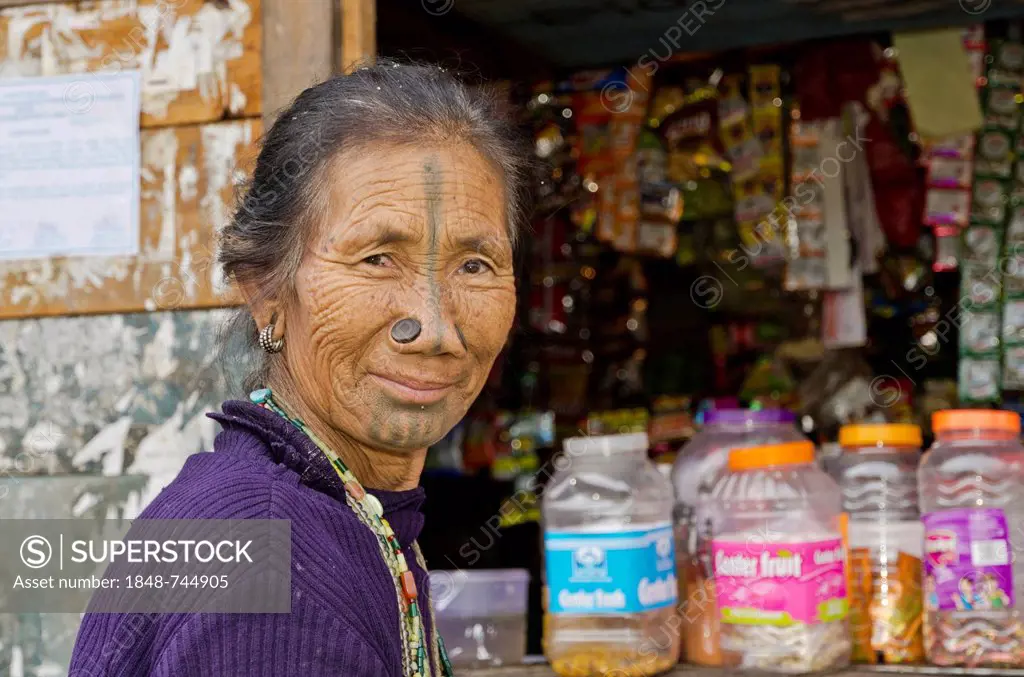 Apatani woman with the traditional bamboo discs in her nostrils, a custom supposed to prevent young Apatani women from being abducted, now banned, Hon...