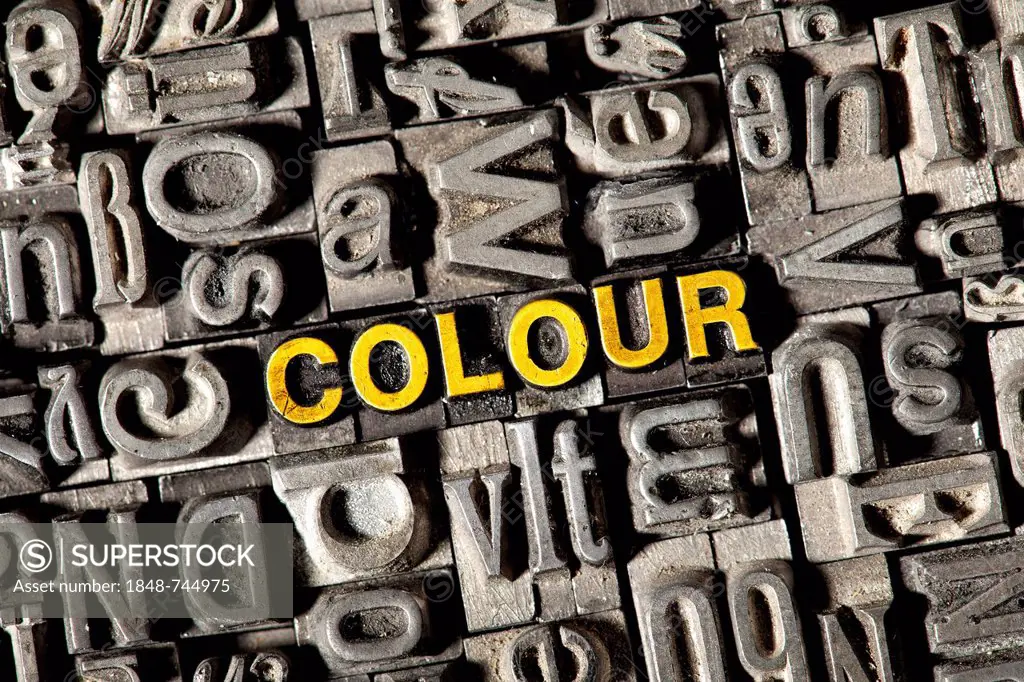 Old lead letters forming the word COLOUR