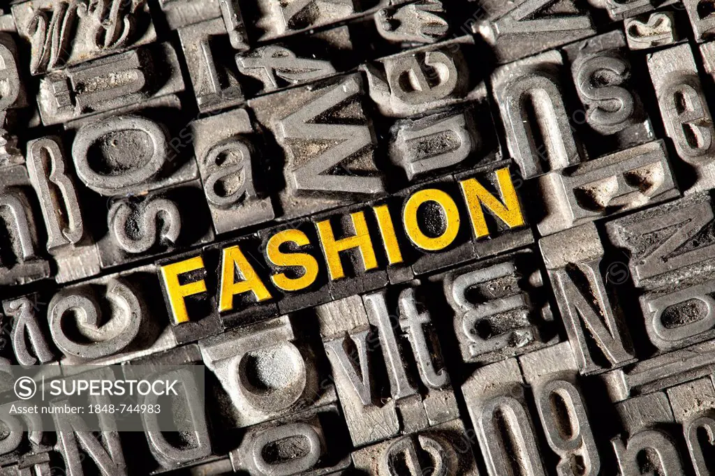Old lead letters forming the word FASHION