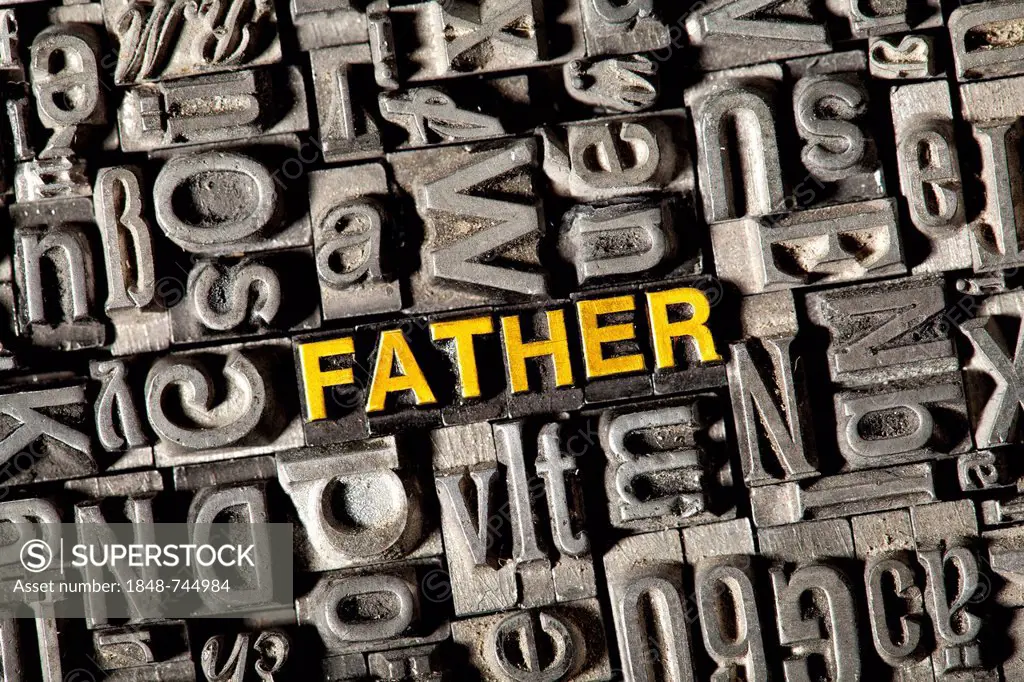 Old lead letters forming the word FATHER
